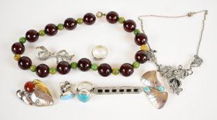 A collection of silver jewellery including brooch set with onyx and marcasite, turquoise ring,