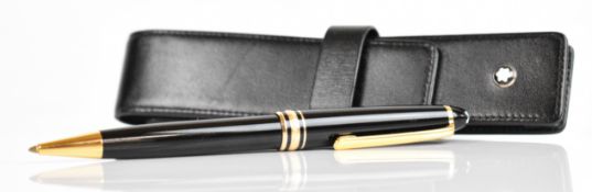 Montblanc ballpoint pen with black resin barrel and cap and gold plated fittings, in original case.
