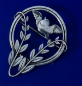 Georg Jensen silver brooch in the form of a bird and foliage, design number 258 by Arno
