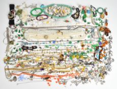 A collection of jewellery, some silver including three pairs of earrings set with pressed amber,