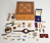 A collection of items including Dunhill money clip, silver pocket watch in WW1 strap, miniature gun,