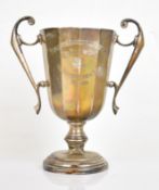 Art Deco hallmarked silver trophy cup with 12 sided tapering body, twin handles and Brecon farming