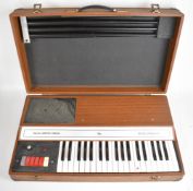 Dallas Arbiter / Crumor 'Scalatronic' portable organ, in fitted carry case with removable legs, made
