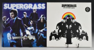 Two Supergrass LPs, both 1st presses. Life On Other Planets.Parlophone – 7243 5 41800 1 9.