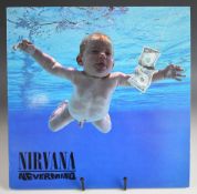 Nirvana Nevermind LP GEF 24425, early press with inverted monkey and text on rear of inside cover.