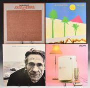 Four LPs by The Cure. Standing on a Beach, Three Imaginary Boys (with insert), Boys Don't Cry and