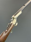J Stevens Tip-Up .22 hammer action target rifle with adjustable folding peep-hole sights, spurred