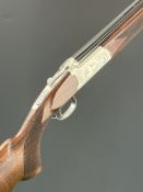 Yildiz .410 over and under assisted-opening ejector shotgun with engraved scenes of birds and dogs