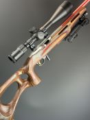 Ruger Model 10/22 .22 semi-automatic rifle with laminate show wood stock, thumb-hole grip, raised