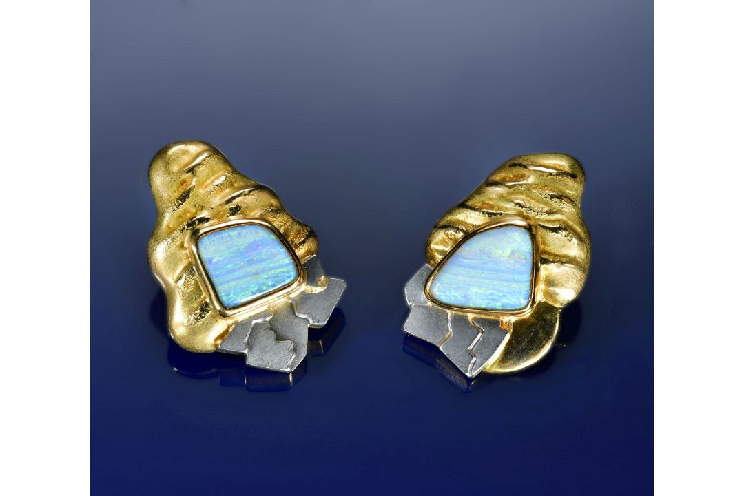 A pair of contemporary 18ct gold bi-coloured earrings with textured detailing, each set with an opal