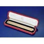 Cartier 18ct gold bracelet c1970s, made up of multiple rows of closely interwoven flattened curb