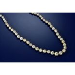 A single strand of eighty-six graduated natural saltwater pearls ranging from 3.2mm to 7.3mm,