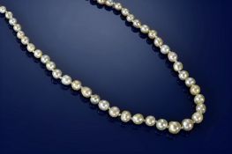 A single strand of eighty-six graduated natural saltwater pearls ranging from 3.2mm to 7.3mm,