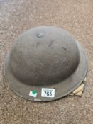 An Original WWII British Military Helmet, complete, original paint finish, liner, chin strap