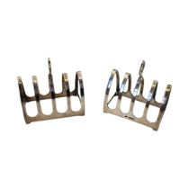 A PAIR OF EARLY 20TH CENTURY SILVER TOAST RACKS Having a cruciform handle, hallmarked Sheffield,