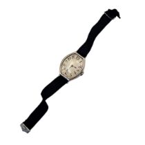 AN ART DECO SILVER GENT’S WRISTWATCH Lozenge form, with Arabic numbers and mechanical movement, on a