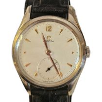 OMEGA, A MID CENTURY STAINLESS STEEL GENT’S WRISTWATCH The circular silvered dial with applied