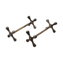 A PAIR OF VICTORIAN SILVER KNIFE RESTS Having cross form ends, hallmarked London, 1900. (approx 8cm,