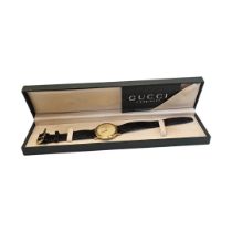 GUCCI, A VINTAGE GOLD PLATED GENTS WRISTWATCH Plain form, with gold tone dial and marked to case