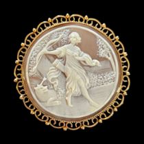 A VINTAGE 9CT GOLD AND SHELL CAMEO BROOCH The circular form with fine decoration of Diana the