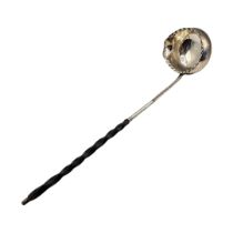 A GEORGIAN WHITE METAL AND WHALE BONE PUNCH LADLE Having scalloped edge and spout to bowl and