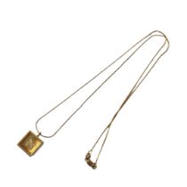 A VINTAGE 18CT GOLD AND DIAMOND CUBE PENDANT Containing the initial ‘No’ in round cut diamonds, on a