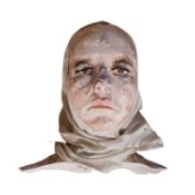 A 20TH CENTURY LIFE SIZE PLASTER PORTRAIT BUST Female with brown glass eyes and head scarf. (34cm)