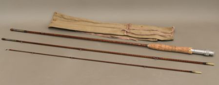 A 1920s unmarked trout rod - three-piece, 8¾ ft., with canvas sleeve. Condition - some cork