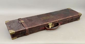 A William Evans brass-mounted leather guncase - the baize-lined interior in good condition and