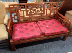 CHINESE HARDWOOD SETTEE WITH CARVED DRAGON FRET-WORK BACK
