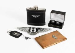 A Sckall Gilt-Metal Cigarette Case, with Bentley winged emblem A Modern Bentley Stainless Steel
