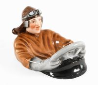 A Continental 1920's/30's Novelty Ashtray, modelled as a driver wearing a brown coat, helmet and