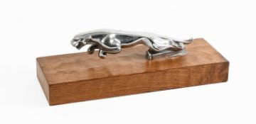 A 1950's Jaguar Chromed Car Mascot, mounted on an adzed oak rectangular base by Wren Cabinet Makers,