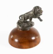 Morris Marx: A 1920's Brass and Silver Plated Car Mascot, modelled as a Lion standing on a rocky