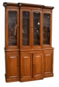 A Victorian Oak Breakfront Bookcase, with glazed upper section, 156cm by 47cm by 227cm Pieces from