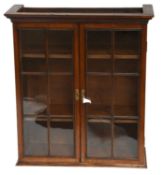 A George III Oak Bookcase Top, the glazed doors, opening to reveal adjustable shelves, 77cm by