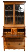 A 19th Century Crossbanded and Inlaid Mahogany Secretaire Bookcase, the moulded cornice over a