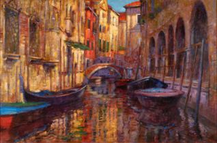 John Mackie (b.1953) Gondolas moored on a Venetian backwater Signed, oil on canvas, 100cm by 151cm