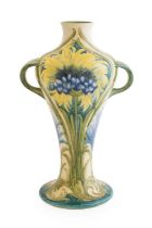 William Moorcroft (1872-1945) for James Macintyre: A Revived Cornflower Vase, 1912, on a white