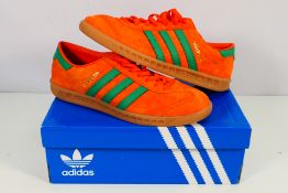 Adidas - A pair of Hamburg trainers in orange and green, UK size 9, contained in original box.
