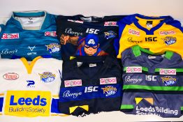 Six Leeds Rhinos rugby shirts, sizes 2XL and 4XL. Generally good condition with wear to some.