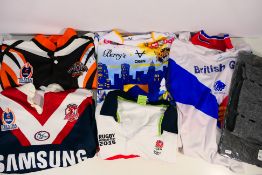 Lot to include a Wests Tigers rugby shirt, size L (bearing signature), a Sydney Roosters XL shirt,