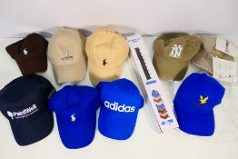 A collection of baseball caps to include Adidas,
