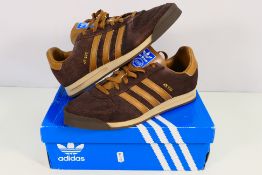 Adidas - A pair of AS 520 trainers in brown, UK size 9½, contained in non-original Adidas box.