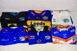Six Leeds Rhinos shirts, sizes to include L, XL and XXL.
