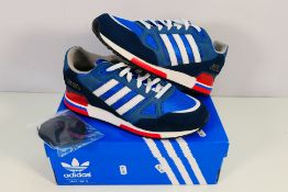 Adidas - A pair of ZX750 trainers in blue, white and red, UK size 9½,