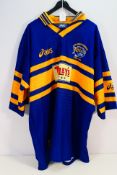 A Leeds Rhinos Asics shirt bearing multiple signatures, size XL. Appears in good condition overall.
