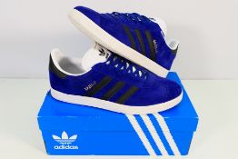 Adidas - A pair of Gazelle trainers in violet and black, UK size 9.