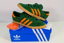 Adidas - A pair of Stadt trainers in green and orange, UK size 9,