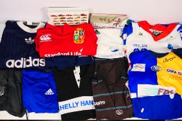 A collection of sportswear to include rugby shirts, shorts, polo shirts and other,